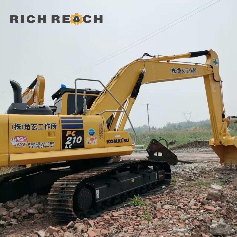 Cab interior and monitor display of a 2018 Komatsu PC210 excavator priced at $30,556
